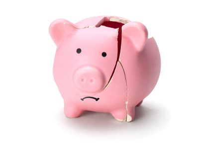 Broken piggy bank isolated on white background.