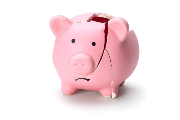 Broken piggy bank isolated on white background.