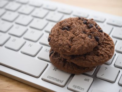 Chocolate,Chip,Cookies,On,Keyboard,Computer,Background,Copy,Space.,Cookies